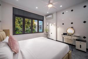 En eller flere senge i et værelse på Meis House Homestay