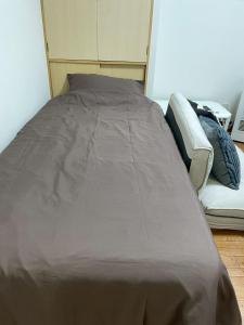 Postel nebo postele na pokoji v ubytování Odori Park Soba Sapporo, Susuki Convenient for sightseeing 1R Highway 702