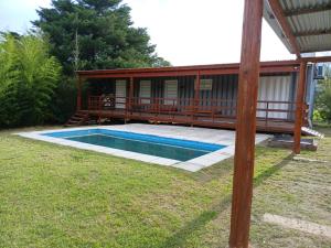 a house with a swimming pool in the yard at Cabaña Habibi in Potrero de Garay +52 photos