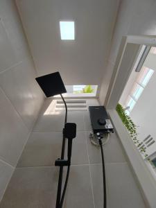 a room with a table and a lamp in the attic at Zen Retreat KL in Kuala Lumpur