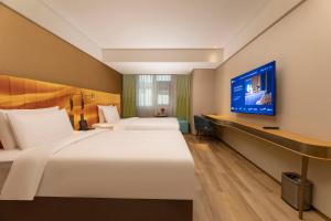 TV a/nebo společenská místnost v ubytování Manxin Hotel, Guanqian Street, Suzhou