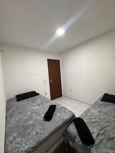 En eller flere senge i et værelse på Ap 1km da praia com suite