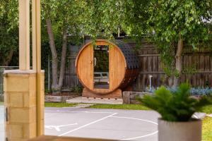 a wooden circle sitting on top of a tennis court at Play on Balcombe in Mount Martha