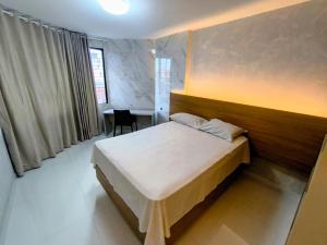 En eller flere senge i et værelse på Victory Preminum + 7 billeder