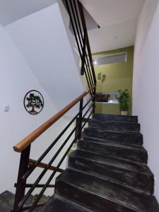 a staircase leading up to the second floor of a house at koi Residencial 301 in Chimbote +2 photos