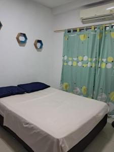 Postel nebo postele na pokoji v ubytování Apartaestudio Norte de Neiva