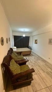 a living room with a couch and a bed at Satya park in Mar del Plata