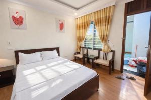 En eller flere senge i et værelse på Hà Tiên Motel