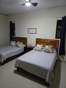 Postel nebo postele na pokoji v ubytování Hanna Suite