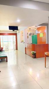 a lobby of a hospital with a reception desk at Sang Surya Guest House in Bandung