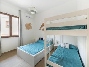 En eller flere senge i et værelse på Apartment with air conditioning