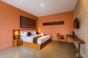 En eller flere senge i et værelse på ME Villa Pererenan