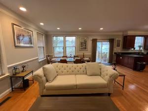 a living room with a white couch in a room at 25 Lux King Suite 1 - Private Bath, Nonsmoking in Arlington