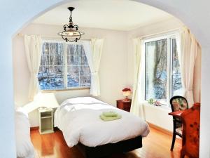 Postel nebo postele na pokoji v ubytování Asahikawa - house / Vacation STAY 5789