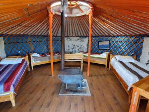 Giường trong phòng chung tại Hunnu Camp