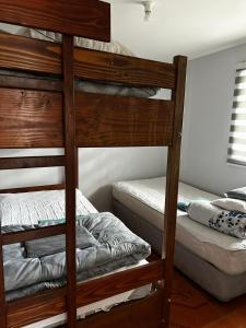 En eller flere senge i et værelse på COMODO Y AMPLIO DEPARTAMENTO, Temuco