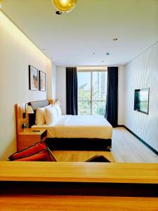 Giường trong phòng chung tại Orchid Parc