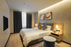 Giường trong phòng chung tại Orchid Parc