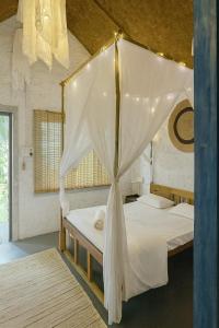 En eller flere senge i et værelse på CASA de SAZU