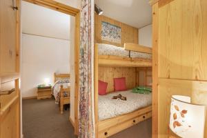 Giường trong phòng chung tại Appartamento Quota 1800 - Happy Rentals