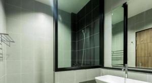 a bathroom with a sink and a mirror at Seven bee boutique hotel in Surin