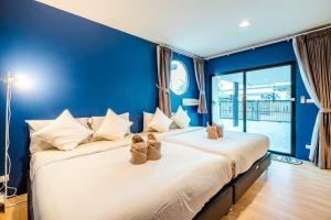 En eller flere senge i et værelse på The Connect Pool Villa Cha Am + 55 billeder