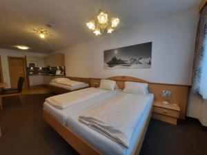 a bedroom with a large bed in a room at Haus Roman Falch in Sankt Anton am Arlberg