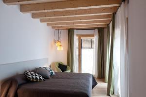 Postel nebo postele na pokoji v ubytování Casa Del Castell