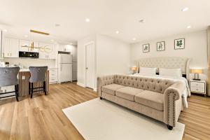 a living room with a bed and a couch at Lyn's Stay in Westminster