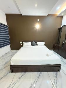 Postel nebo postele na pokoji v ubytování Zeekka Tourist Home + 1 fotografie