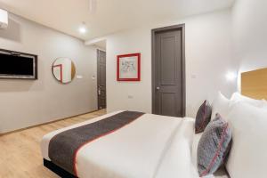 En eller flere senge i et værelse på Townhouse Alwar Railway Junction + 11 billeder