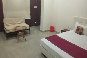 Ένα ή περισσότερα κρεβάτια σε δωμάτιο στο POP 84163F Hotel Bidhan's Inn