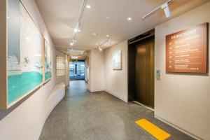 a hallway in a building with a sign on the wall at Daebudo Urban Island in Ansan