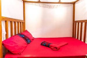 Giường trong phòng chung tại Gecko Cottage