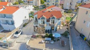 an aerial view of a house with a roof at Luxury Beach Villa, Sibenik in Šibenik