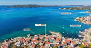 an aerial view of a small island in the water at Luxury Beach Villa, Sibenik in Šibenik +44 photos