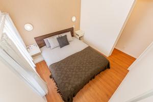 En eller flere senge i et værelse på KAKURE Yahiro 3-Chome New 2LDK House,Washer-Dryer & Free Parking,1 Stop to Skytree