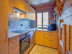 a kitchen with a sink and a stove top oven at Chalet in Hochfügen near Ski Slopes in Hochfugen +33 photos
