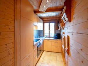 a kitchen with wooden walls and wooden counters at Chalet in Hochfügen near Ski Slopes in Hochfugen