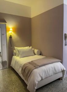 Postel nebo postele na pokoji v ubytování Dimora minima