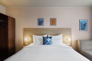 Postel nebo postele na pokoji v ubytování Four Points Flex by Sheraton Salzburg Messe