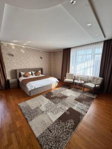 En eller flere senge i et værelse på Apart Hotel 5