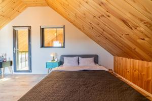 En eller flere senge i et værelse på Cabana Alpinest