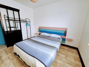 Postel nebo postele na pokoji v ubytování Proche Puy du Fou - Petite maison tendance loft