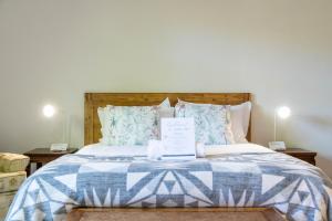 a bed with a blue and white blanket and pillows at Staymore in Stellenbosch +53 photos