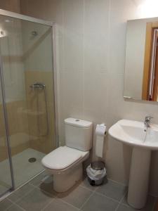 a bathroom with a toilet and a sink and a shower at Albergue Segunda Etapa in Zubiri