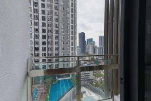 a view of a large building from a window at SS KL Sentral by NomadNest in Kuala Lumpur