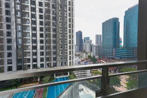 a view of a city from a balcony of a building at SS KL Sentral by NomadNest in Kuala Lumpur
