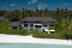 an aerial view of a house on a beach at Madifushi Private Island- Stay 5 Nights or More & Enjoy Free Roundtrip DOMESTIC FLIGHT & SPEEDBOAT in Meemu Atoll