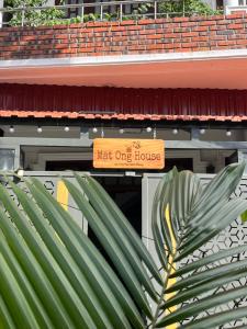 a meet one house sign in front of a building at Mật Ong HOUSE in Hue +20 photos